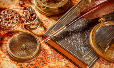 vintage magnifying glass lies on an ancient world map