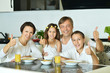 © aletia2011 - mother with kids eating at table