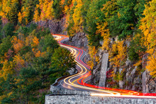 Traffic Light Trails On Hawk's Nest Winding Road (route 97) In Upstate New York, On An Autumn Evening.