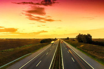 Cars speeding on a highway