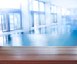 © nuttapol - Wood Table Top Background And Pool