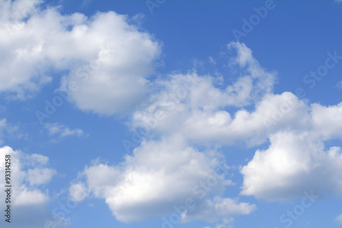 Nowoczesny obraz na płótnie Light white clouds slowly float high in the blue sky