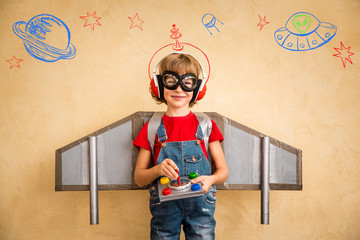 Poster - Kid pilot with toy jetpack playing at home