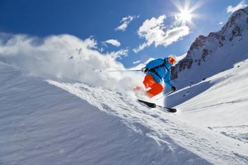 Wall Mural - Man skier running downhill