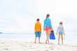 © TravelPhotoBloggers - Mother with kids at beach