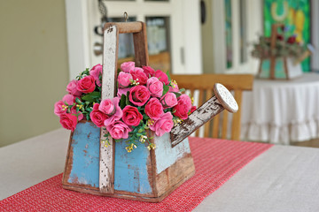 Wall Mural - rose artificial flower in wooden flowerpot