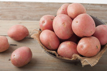 Red Potatoes In A Bowl On Wooden Background