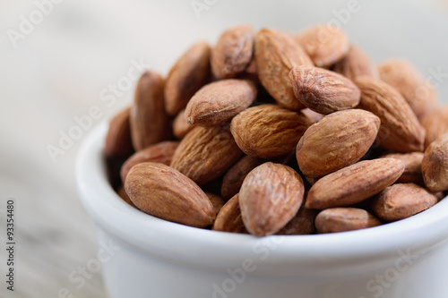 Fotomural Bowl of Almond Nuts on Rustic Wooden Table