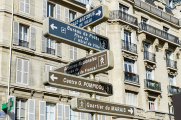 Wall Mural - Street sign with directions in Paris