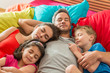 © jackfrog - A family is taking a nap all together in a colorful bed