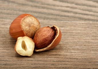 Wall Mural - hazelnuts on wooden background