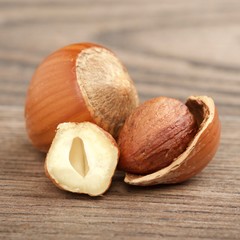 Wall Mural - hazelnuts on wooden background