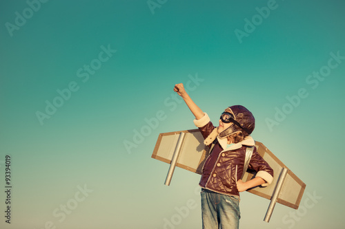 Photo: Happy child playing with toy airplane Happy child playing with toy airplane