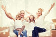© Syda Productions - smiling parents and two little girls at new home