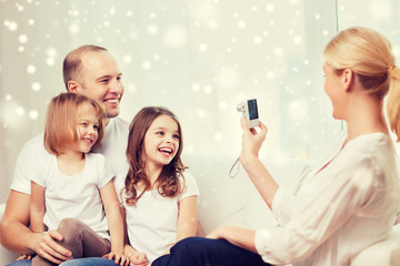 Poster - happy family with camera taking picture at home