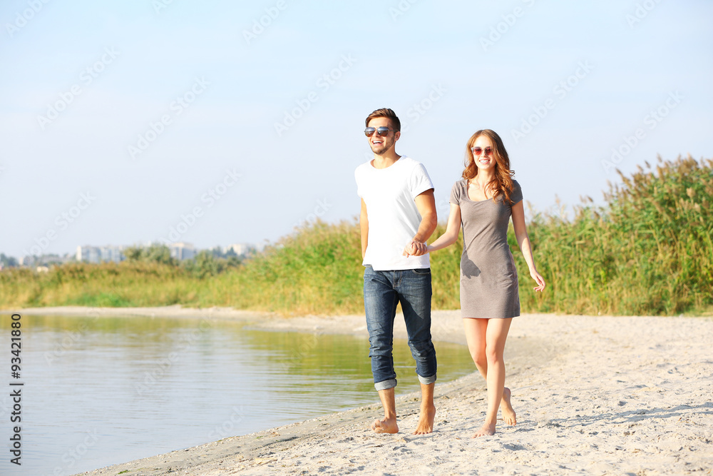Young couple on the riverside