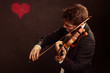 © Voyagerix - Man violinist playing violin. Classical music art
