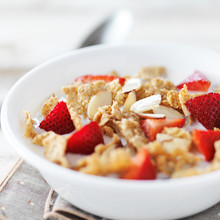 Bowl Of Cereal With Strawberries And Almonds