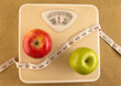 © pkstock - Weighting scale with apples and measuring tape