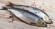 Herrings on a wooden background.