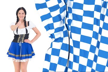 Wall Mural - Composite image of pretty oktoberfest girl posing and smiling