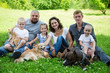 Big happy family with dogs and cat