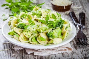 Wall Mural - homemade pasta orecchiette with broccoli, Parmesan cheese and basil