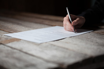 Wall Mural - woman hand signing document