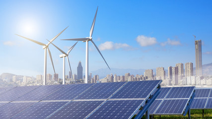 solar panels and wind turbines with city
