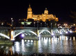 Historic city of Salamanca with river Tormes at night, Spain