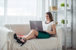 © undrey - Attractive woman with laptop having break in office