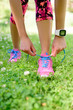 Weight loss - runner tying laces with smartwatch