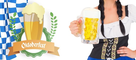 Wall Mural - Composite image of pretty oktoberfest girl holding beer tankard