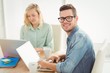 © WavebreakMediaMicro - Portrait of smiling young man wearing eyeglasses with woman