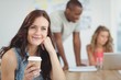© WavebreakMediaMicro - Thoughtful woman holding coffee cup while sitting at desk