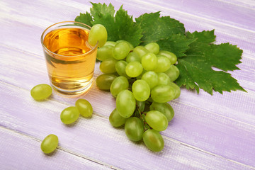 Poster - Glass of grape juice on wooden background