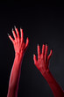 © Elisanth - Red devilish hands with black nails, body-art