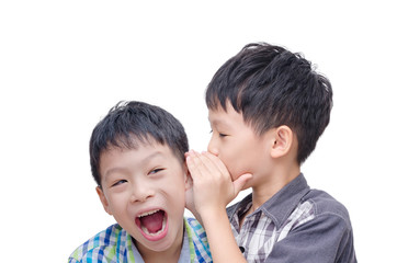 Young Asian brother whispering his twin on white background