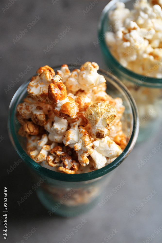 Popcorn in glasses on dark background