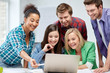 © Syda Productions - group of happy high school students with laptop