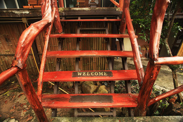 Wall Mural - wooden steps with an inscription welcome