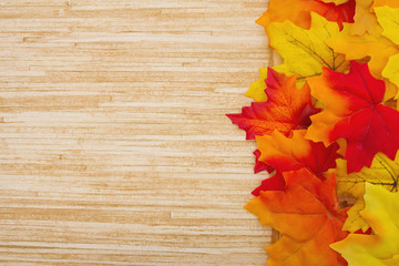 Wall Mural - Autumn Leaves and Weather Wood Background