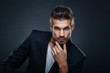 © djile - Portrait of handsome man in a studio on a dark background