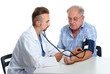 © grinny - Doctor checking patient blood pressure.