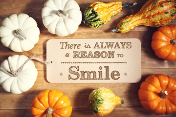 Wall Mural - There is Always a Reason to Smile message with pumpkins