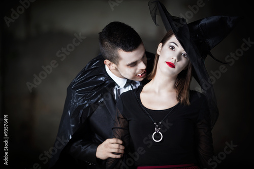 Male Vampire Kissing Witch in the Neck Stock Photo | Adobe Stock