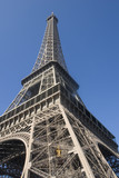 Fototapeta Boho - Elevator climbs the lower leg of Eiffel Tower.Paris, France