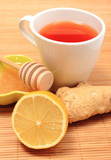 Fototapeta Kuchnia - Cup of healthy tea with honey ginger and lemon