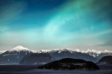Wall Mural - Northern lights aurora borealis in the night sky over beautiful lake landscape