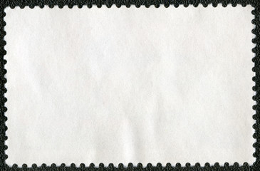 Blank postage stamp sheet on a black background